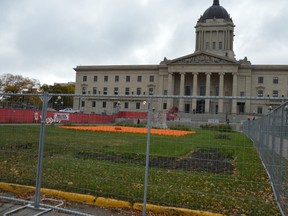 A chain-link fence now surrounds the area where an encampment on the north side of the Manitoba Legislative Building stood, after police moved in and forced people out of the encampment this week.