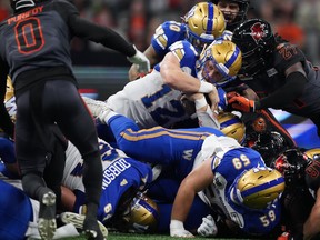 Winnipeg Blue Bombers quarterback Dakota Prukop pushes ahead for a first down during the first half of CFL action against the B.C. Lions in Vancouver on Saturday, Oct. 15.
