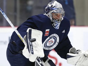 Connor Hellebuyck makes a save during Winnipeg Jets training camp.