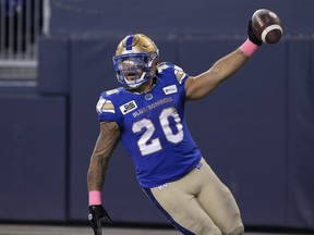 Winnipeg Blue Bombers' Brady Oliveira (20) celebrates his touchdown against the Edmonton Elks during first half CFL action in Winnipeg on Saturday, October 8, 2022.