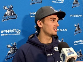 24-year-old Ben Hawerchuk, son of legendary Jets forward Dale, speaks to the media in Winnipeg on Monday, Oct. 3, 2022, after signing a professional tryout contract with the Manitoba Moose.