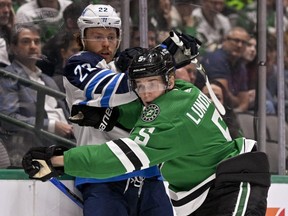 Dallas Stars defenceman Nils Lundkvist checks Winnipeg Jets centre Mason Appleton at the American Airlines Center last night. The Jets lost 4-1.  USA TODAY SPORTS