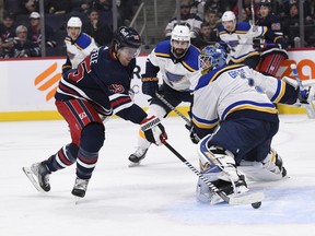 Winnipeg Jets' Mark Scheifele (55) scores on St. Louis Blues goaltender Thomas Greiss (1) during the second period of NHL action in Winnipeg on Monday October 24, 2022. THE CANADIAN PRESS/Fred Greenslade