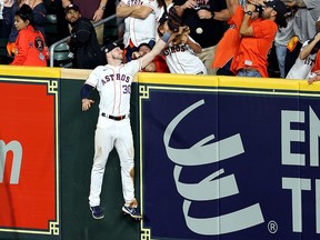Kyle Tucker of the Houston Astros fails to catch a home run hit by J.T. Realmuto of the Philadelphia Phillies in Game One of the 2022 World Series at Minute Maid Park on October 28, 2022 in Houston.
