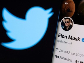 Elon Musk's twitter account is seen on a smartphone in front of the Twitter logo in this photo illustration taken April 15, 2022.