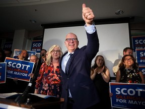 A thumbs-up from Scott Gillingham, with wife Marla, after being elected the mayor at the Clarion Hotel in Winnipeg on Wed., Oct. 26, 2022. KEVIN KING/Winnipeg Sun