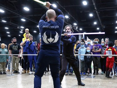 River City Jedi members locked in a lightsabre duel during Winnipeg Comiccon at the RBC Convention Centre on Sunday, Oct. 30, 2022.