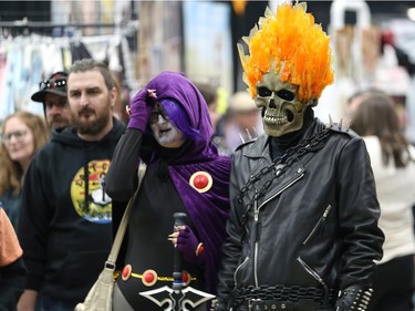 Ghost Rider (right) and Raven from Teen Titans watch a demonstration during Winnipeg Comiccon at the RBC Convention Centre on Sunday, Oct. 30, 2022.