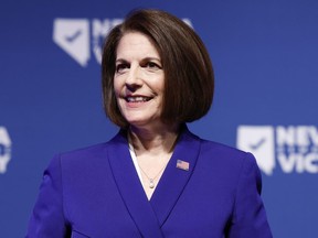 U.S. Sen. Catherine Cortez Masto (D-NV) listens as Nevada Gov. Steve Sisolak delivers remarks at an election night party hosted by Nevada Democratic Victory at The Encore on November 08, 2022 in Las Vegas, Nevada.