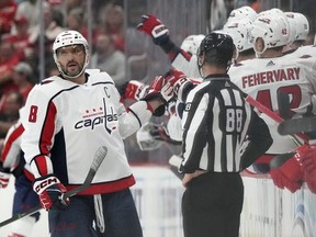 Capitals left wing Alex Ovechkin greets teammates after scoring during the second period against the Red Wings in Detroit, Thursday, Nov. 3, 2022.