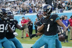 Jacksonville Jaguars wide receiver Zay Jones (7) celebrates a two-point conversion catch with his team during the second half of an NFL football game against the Baltimore Ravens, Sunday, Nov. 27, 2022, in Jacksonville, Fla.