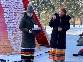 Elder Rebecca Ross, right, a friend of Helen Betty Osborne before her 1971 death, spoke at a ceremony and Sacred Fire held at the Rainbow Butterfly Warming Hut in Kildonan Park in Winnipeg on Monday to mark the 51st anniversary of Osborne’s murder. Dave Baxter/Winnipeg Sun/Local Journalism Initiative