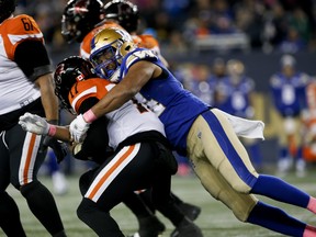 The Blue Bombers' Jackson Jeffcoat (94) sacks B.C. Lions quarterback Antonio Pipkin during a game on Oct. 2. The two teams are set to clash in the CFL West final.