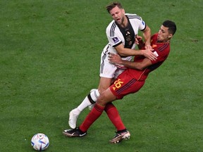 Germany's forward Niclas Fullkrug, left, and Spain's midfielder Rodri collide during the Qatar 2022 World Cup Group E match at the Al-Bayt Stadium in Al Khor, north of Doha, Sunday, Nov. 27, 2022.