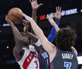 Toronto Raptors forward O.G. Anunoby (3) is defended by Oklahoma City Thunder guard Josh Giddey (3) on a shot during the second quarter at Paycom Center.