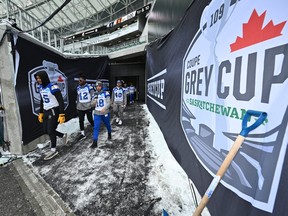Winnipeg Blue Bombers players walk out onto the field during a team on field  walk through as they get ready to take on the Toronto Argonauts at the 109th Grey Cup at Mosaic Stadium in Regina on Saturday, Nov. 19, 2022.