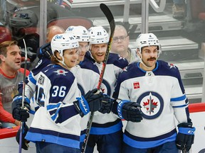 Winnipeg Jets right wing Saku Maenalanen (8) celebrates with teammates after scoring against the Chicago Blackhawks during the second period at United Center in Chicago on Sunday, Nov. 27, 2022.