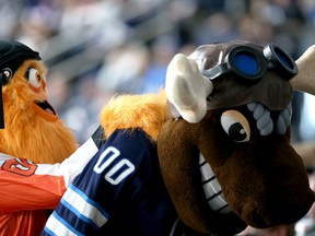 Winnipeg Jets mascot Mick E. Moose (right) and Philadelphia Flyers mascot Gritty clown around in the stands in Winnipeg on Wednesday, April 27, 2022. Mick E. Moose ended up No. 2 in a survey of more than 900 NHL fans while in the least shocking news of the study, Gritty took first place for most obnoxious mascot in the league.