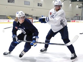 Winnipeg Jets forward Kyle Connor (left) battles with Pierre-Luc Dubois during practice on Tuesday, Nov. 1, 2022.