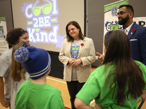 Premier Heather Stefanson (centre) and Fort Whyte MLA Obby Khan (right) chat with students as the Winnipeg Police Association kicked off its 11th annual Cool 2B Kind campaign at Queenston School in Winnipeg on Mon., Nov. 7, 2022.  KEVIN KING/Winnipeg Sun
