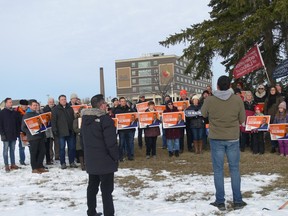 NDP Leader Wab Kinew (right) and Kirkfield Park byelection candidate Logan Oxenham (left) address a campaign rally in front of the Grace Hospital in Winnipeg on Sunday, Nov. 27, 2022, condemning the PC government's cuts to health care.