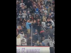 Screenshot of an apparent fight in the stands between spectators at the Winnipeg Jets game against Colorado Avalanche just as the teams were coming out for the third period of the 5-0 Jets win on Tuesday, Nov. 29, 2022.