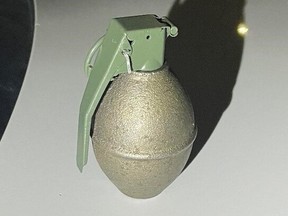Winnipeg Police released a photo of a grenade on Tuesday, Nov. 22, 2022. Winnipeg Police said officers seized a grenade at around 1 a.m., on Monday, Nov. 21, concealed in the clothing of a suspect. The area was cordoned off for safety precautions. The grenade was determined to be "live" and was safely extracted and disposed of by the Bomb Unit, who later determined it to be non-viable.