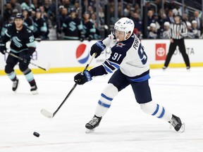 Cole Perfetti (91) of the Winnipeg Jets shoots during the first period against the Seattle Kraken at Climate Pledge Arena on Dec. 18, 2022 in Seattle.