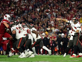 Tom Brady #12 of the Tampa Bay Buccaneers passes during the 2nd quarter of the game against the Arizona Cardinals at State Farm Stadium on December 25, 2022 in Glendale, Arizona.