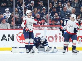 Washington Capitals forward Conor Sheary (73) is congratulated by teammates on his goal against the Winnipeg Jets at Canada Life Centre on Sunday.