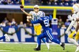 Los Angeles Chargers quarterback Justin Herbert (10) passes the ball while Indianapolis Colts defensive end Kwity Paye (51) defends in the second half at Lucas Oil Stadiumon Dec 26, 2022 in Indianapolis.