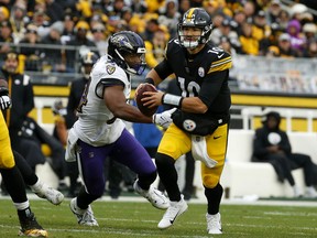 Mitch Trubisky of the Pittsburgh Steelers scrambles with the ball during the fourth quarter of the game at Acrisure Stadium on December 11, 2022 in Pittsburgh, Pennsylvania.