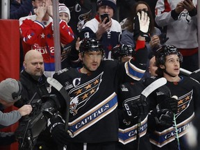 Capitals left winger Alex Ovechkin waves to the crowd after scoring against the Jets at Capital One Arena. It was Ovechkin’s 801st career goal, moving him into second place all-time in career NHL goals, tying the late Gordie Howe.  USA TODAY Sports