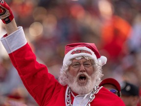 San Francisco 49ers fan dressed as Santa Claus cheers during the third quarter against the Washington Commanders at Levi's Stadium. Mandatory