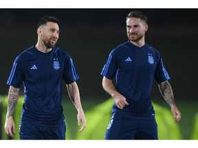 Argentina's forward #10 Lionel Messi (L) and Argentina's midfielder #20 Alexis Mac Allister take part in a training session at Qatar University training site 3 in Doha on December 17, 2022, on the eve of the Qatar 2022 World Cup football final match between Argentina and France.
