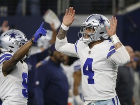 Dallas Cowboys' Dak Prescott celebrates a touchdown during the second half of an NFL football game against the Philadelphia Eagles Saturday, Dec. 24, 2022, in Arlington, Texas.