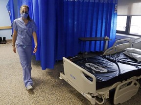Registered nurse Courtney Benoit walks through the special care unit of Campbellford Memorial Hospital in Campbellford, Ont., Feb. 10, 2022.