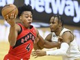 Toronto Raptors forward Scottie Barnes (4) drives against Cleveland Cavaliers forward Isaac Okoro (35) at Rocket Mortgage FieldHouse.