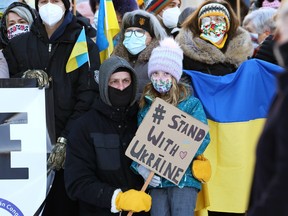 People rally outside City Hall in Winnipeg in support of Ukraine against Russian aggression on Sun., Feb. 6, 2022. Russia would invade Ukraine weeks later and war continues to this day.