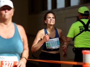 A half-marathon participant enters IG Field during the Manitoba Marathon in Winnipeg on Sun., June 19, 2022.