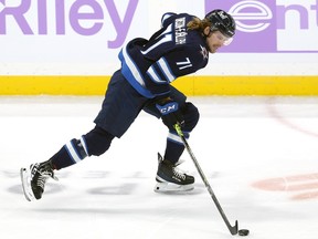 Winnipeg Jets forward Axel Jonsson-Fjallby carries the puck against the Colorado Avalanche in Winnipeg on Tuesday, Nov. 29, 2022.