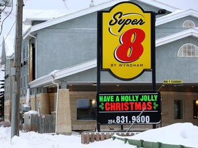 The Super 8 by Wyndham Winnipeg West Hotel is pictured in Winnipeg on Monday, Dec. 19, 2022. Police have charged an 18-year-old man and two teenage females with attempted murder and arson-related charges after a female was discovered unconscious inside a suite on Sunday.