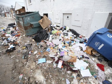 A garbage strewn back lane in Winnipeg on Tuesday, April 5, 2022.