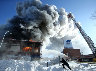 A large structure fire on Portage Avenue at Langside Street in Winnipeg on Wednesday, Feb. 2, 2022.