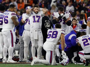 Buffalo Bills players react after teammate Damar Hamlin (3) was injured against the Cincinnati Bengals during the first quarter at Paycor Stadium on Jan. 2, 2023 in Cincinnati.