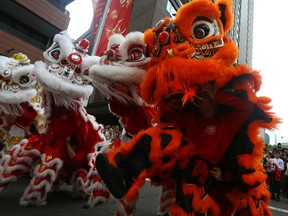 Members of the Chinese Youth League perform a lion dance for onlookers at Haymarket on Jan. 21, 2023 in Sydney, Australia. The Lunar New Year or Spring Festival marks the transition of the Chinese zodiac sign from one animal to the next. 2023 sees in the Year of the Rabbit, which begins on Jan. 22. In Chinese culture, the Rabbit is a symbol of longevity, peace and prosperity. The festival is celebrated in Australia by the country's significant Chinese-origin minority, who follow much of the same traditions as the Chinese diaspora in the rest of the world.