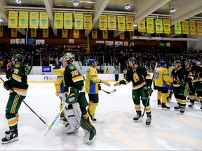 Members of the University of Alberta Golden Bears and Ukrainian Men’s U25 National Hockey Team shake hands following a charity hockey game at Clare Drake Arena, in Edmonton Tuesday Jan. 03, 2023. The game was a fundraiser for people affected by the Russian invasion of Ukraine. The team plays the University of Manitoba Bisons at Canada Life Centre Monday. David Bloom/Postmedia
