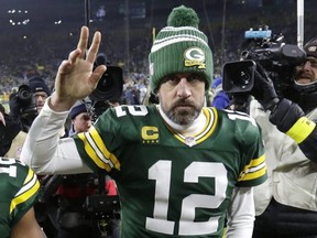 Packers quarterback Aaron Rodgers leaves the field after losing to the Lions at Lambeau Field in Green Bay, Wis., Jan. 8, 2023.