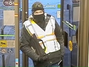 A surveillance image shows a man who allegedly robbed a credit union in Lowe Farm on Nov. 14. RCMP handout
