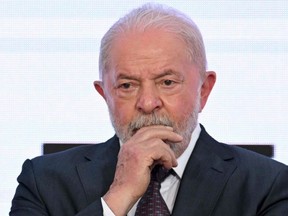 Brazilian President Luiz Inacio Lula da Silva gestures during the swearing-in ceremony of Vice-President Geraldo Alckmin as Minister of Industry and Trade, at Planalto Palace in Brasilia, Wednesday, Jan. 4, 2023.